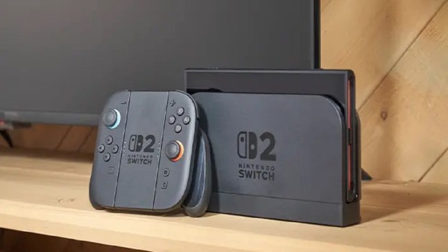 Nintendo Switch 2 docked next to its controller in front of a TV
